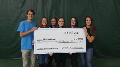 NHS officers with donation check