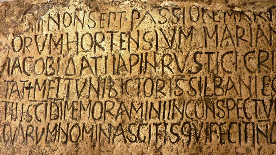 Latin scripture carved on stone  
Photo credit: pxfuel.com