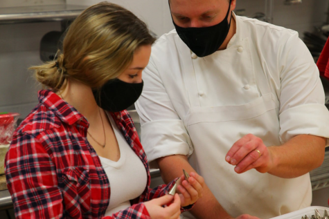 NCTC culinary instructor Adam Monette works with Hailey Hatin (22).
Photo credit: Dino Patsouris