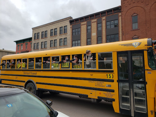 The Comets celebrate their big win with a ride down Main Street.  Photo credit:  Heather Dunigan