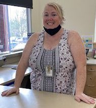 Angela Riley at her desk.
Photo credit:  Georgia Casavant (22)