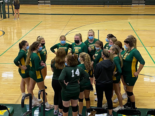 Coach Lauren Liberatore talking to the Junior Varsity girls’ volleyball team. 
Photo Credit: Jennifer Parent 
