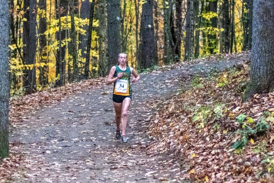 Loghan Hughes races at at the 2021 Vermont Principals Association Cross Country State Tournament  
Photo Credit:  Messenger photographer Adam Laroche