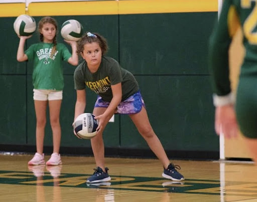 Future Comet Cora Henderson helps out with BFA's Comet volleyball.  Photo credit: Messenger photographer Ari Beauregard