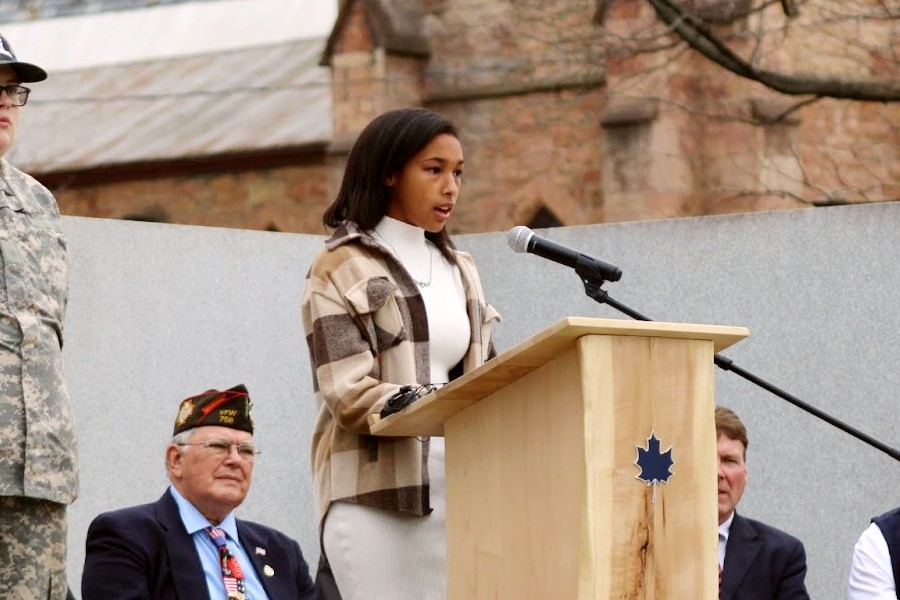 Elora Menard presents her speech at the Veterans' Day ceremony.  Photo credit: Paxton Getty