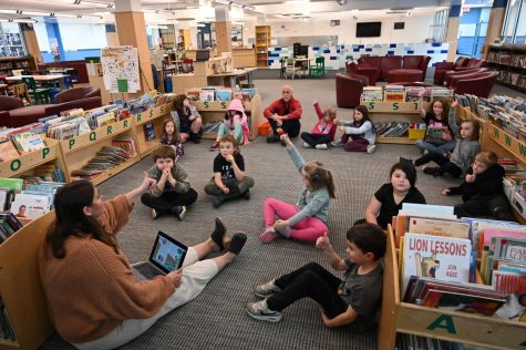 Ashley Levine teaches a lesson to second graders in the City School library.  Photo credit:  Mitch Craib